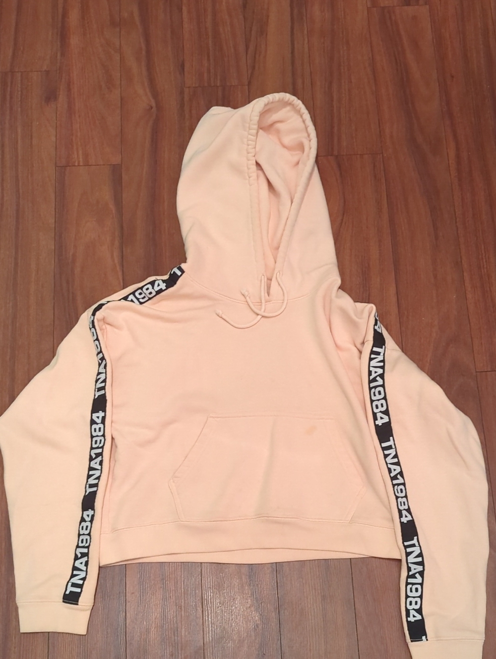 TNA Peach Cropped Hoodie with Black Logo Tape